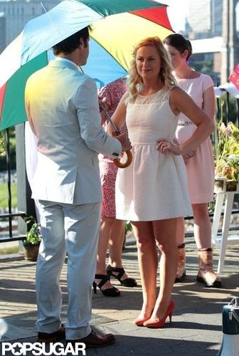 Paul Rudd and Amy Poehler kept cool under umbrellas.
Paul Rudd and Amy Poehler kept cool under umbrellas.