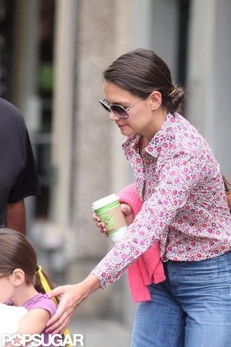 Katie Holmes guided daughter Suri Cruise.
Katie Holmes guided daughter Suri Cruise.