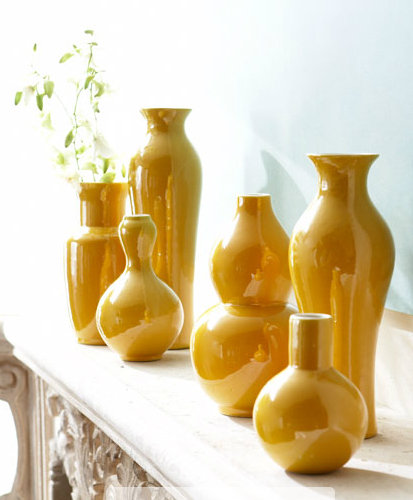 Rather than mixing a variety of colors and patterns, try to keep things sleek with a consistent shade. This set of yellow vases ($245) in varying sizes would add a rich, sunny look to any outdoor space.
Rather than mixing a variety of colors and patterns, try to keep things sleek with a consistent shade. This set of yellow vases ($245) in varying sizes would add a rich, sunny look to any outdoor space.