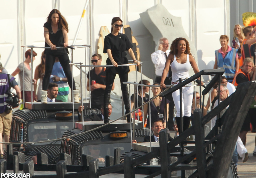 Victoria Beckham, Melanie Brown, and Melanie Chisholm practiced for the closing ceremony as the Spice Girls. Victoria Beckham, Melanie Brown, and Melanie Chisholm practiced for the closing ceremony as the Spice Girls.
