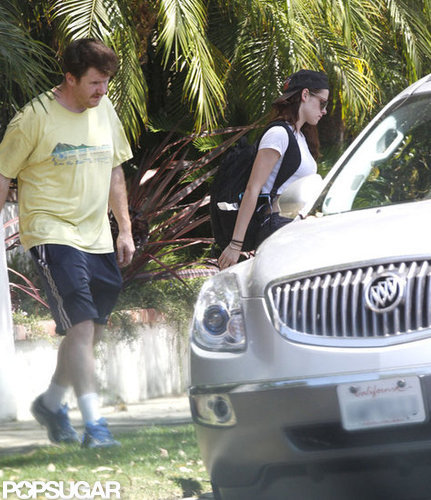 Kristen Stewart walked to a car.
Kristen Stewart walked to a car.