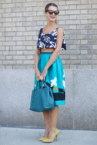 Mixed prints and a bared midriff set this skirt and top apart.
Mixed prints and a bared midriff set this skirt and top apart.