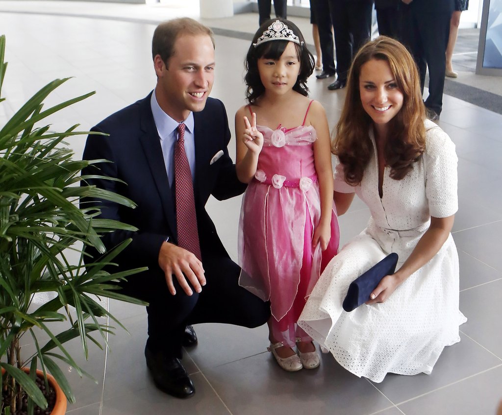 Prince William and Kate posed with a 4-year-old dressed as a princess as they toured a Rolls-Royce factory in Singapore in 2012.
Prince William and Kate posed with a 4-year-old dressed as a princess as they toured a Rolls-Royce factory in Singapore in 2012.