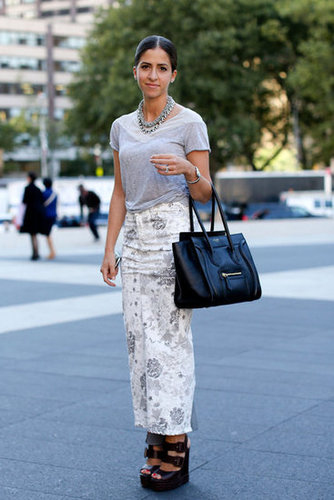A full-length printed skirt gets a touch of luxe via a Céline tote and statement jewels.
A full-length printed skirt gets a touch of luxe via a Céline tote and statement jewels.