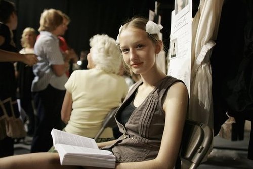 A smiling model looked up from her book during London Fashion Week in 2006.
A smiling model looked up from her book during London Fashion Week in 2006.
