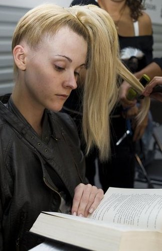 While getting her hair done backstage at the Mercedes Benz Fashion Week in Mexico City in 2010, a model flipped through a hefty book.
While getting her hair done backstage at the Mercedes Benz Fashion Week in Mexico City in 2010, a model flipped through a hefty book.