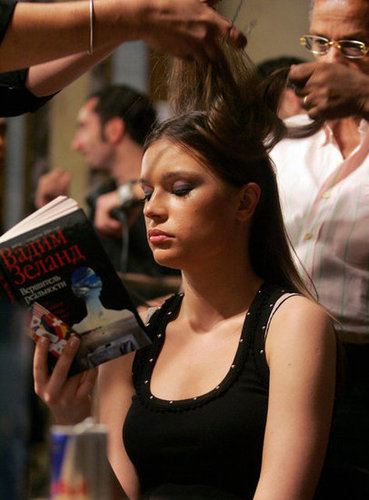 While getting her hair done for Saudi Arabian designer Hanan Madani's fashion show in 2006, a model read a book.
While getting her hair done for Saudi Arabian designer Hanan Madani's fashion show in 2006, a model read a book.
