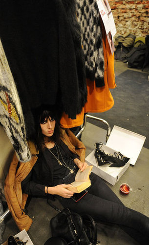 This model looked up from her reading backstage during Milan's Fashion Week in February.
This model looked up from her reading backstage during Milan's Fashion Week in February.
