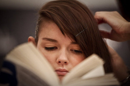This bookish model got her hair done while reading backstage at Ana Moura's fashion show in 2011.
This bookish model got her hair done while reading backstage at Ana Moura's fashion show in 2011.