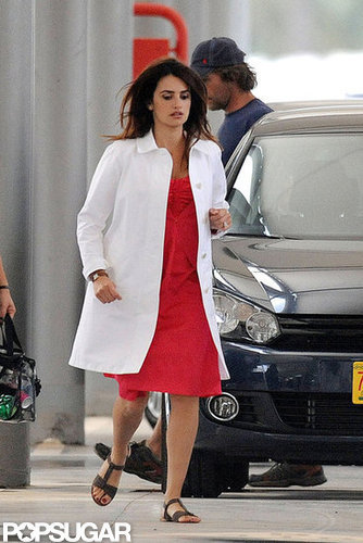 Penelope Cruz switched into a red dress and white coat.
Penelope Cruz switched into a red dress and white coat.