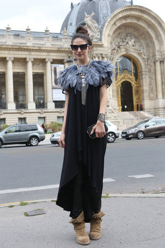 A feathered collar glammed up her dress while a pair of studded biker boots dressed it down.
A feathered collar glammed up her dress while a pair of studded biker boots dressed it down.