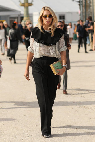A playful collar gave new life to a lacy blouse and black pants — we're also obsessed with her literary clutch.
A playful collar gave new life to a lacy blouse and black pants — we're also obsessed with her literary clutch.