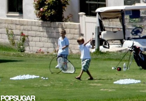 Romeo and Cruz Beckham played around with their clubs in LA in August 2009.
Romeo and Cruz Beckham played around with their clubs in LA in August 2009.