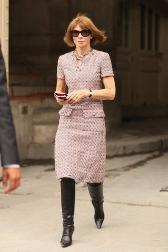 Anna Wintour channeled her editor-in-chief signature in a tweed sheath and knee-high boots.
Anna Wintour channeled her editor-in-chief signature in a tweed sheath and knee-high boots.