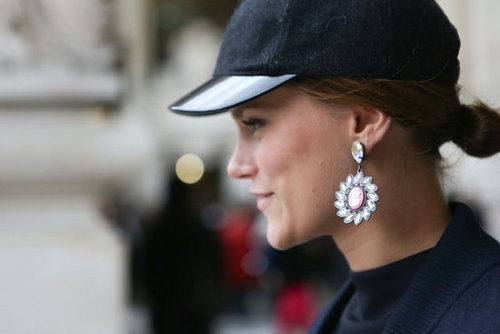 Rhinestone earrings and a tomboy-inspired cap played opposites in this ensemble.
Rhinestone earrings and a tomboy-inspired cap played opposites in this ensemble.