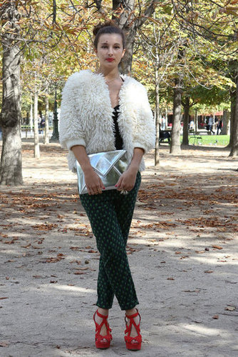 A textured bomber, metallics, and printed pants were all at play in this statement-maker's look.
A textured bomber, metallics, and printed pants were all at play in this statement-maker's look.