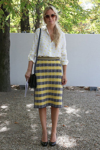 A tweedy skirt and a silk blouse are united by a sweet lemon hue.
A tweedy skirt and a silk blouse are united by a sweet lemon hue.