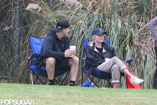 Reese Witherspoon and Jim Toth sat on the sidelines together.
Reese Witherspoon and Jim Toth sat on the sidelines together.
