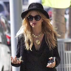 Rachel Zoe Wearing Long Black Sweater