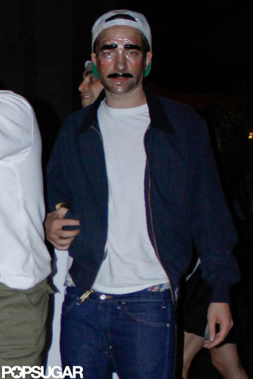 Rob and Kristen Wear Masks For a Hollywood Halloween Bash Rob and Kristen Wear Masks For a Hollywood Halloween Bash