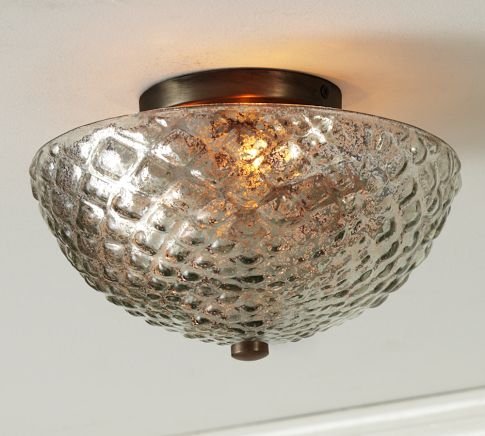 Even overhead lighting can cast a remarkably flattering glow with the right material. This Hobnail Mercury Glass Flushmount ($149) does the trick.
Even overhead lighting can cast a remarkably flattering glow with the right material. This Hobnail Mercury Glass Flushmount ($149) does the trick.
