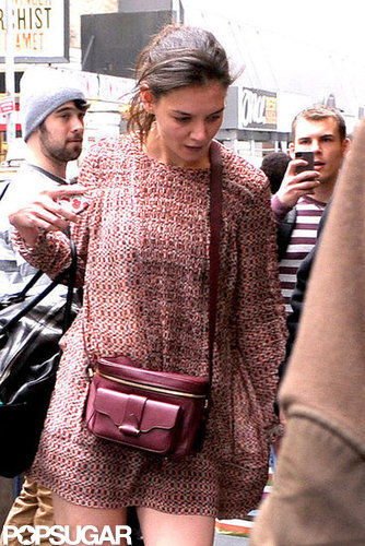 Katie Holmes wore a burgundy bag with a short minidress.
Katie Holmes wore a burgundy bag with a short minidress.