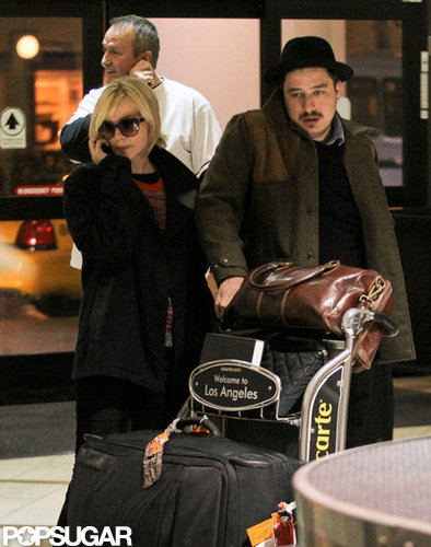 Carey Mulligan and husband Marcus Mumford pushed their bags through the airport.
Carey Mulligan and husband Marcus Mumford pushed their bags through the airport.