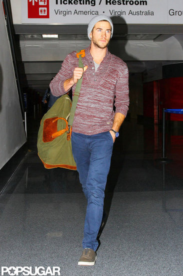 Liam Hemsworth wore a gray beanie. Liam Hemsworth wore a gray beanie.
