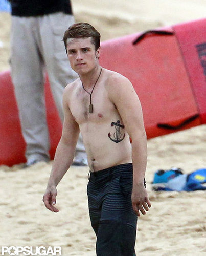 Josh Hutcherson wore a necklace and board shorts.
Josh Hutcherson wore a necklace and board shorts.