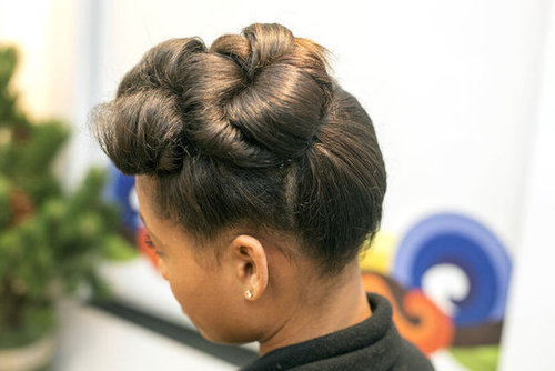 Tame fly-aways by spritzing a comb with hair spray and then sweep the comb over the hair to smooth.
Tame fly-aways by spritzing a comb with hair spray and then sweep the comb over the hair to smooth.