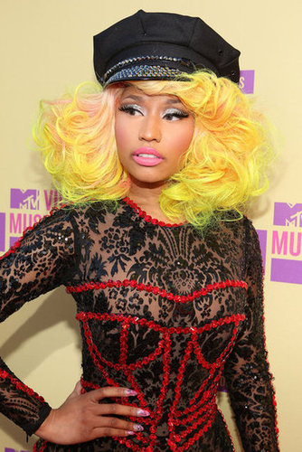 Nicki accessorized her bright hair and sparkly glitter shadow with some seriously cool nail art at the 2012 MTV VMAs.
Nicki accessorized her bright hair and sparkly glitter shadow with some seriously cool nail art at the 2012 MTV VMAs.