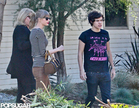 Harry Styles and Taylor Swift stood outside her LA home. Harry Styles and Taylor Swift stood outside her LA home.