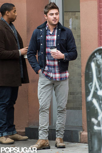 Zac Efron wore gray pants.
Zac Efron wore gray pants.