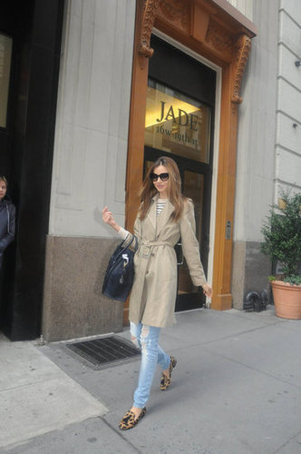 Miranda put a chic spin on classic trench styling by pairing her khaki coat with distressed jeans, leopard-print loafers, and a Céline luggage tote.
Miranda put a chic spin on classic trench styling by pairing her khaki coat with distressed jeans, leopard-print loafers, and a Céline luggage tote.