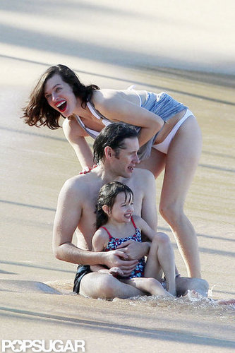 Bikini-Clad Milla Jovovich Poses Beachside With Her Family on NYE Bikini-Clad Milla Jovovich Poses Beachside With Her Family on NYE