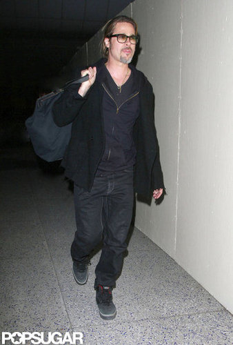 Brad Pitt wore black sneakers and an all-black ensemble to travel to LAX.
Brad Pitt wore black sneakers and an all-black ensemble to travel to LAX.