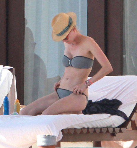 Diane Kruger showed off another perfect two-piece, this time a minimalist bandeau — topped, of course, with her straw fedora.
Diane Kruger showed off another perfect two-piece, this time a minimalist bandeau — topped, of course, with her straw fedora.