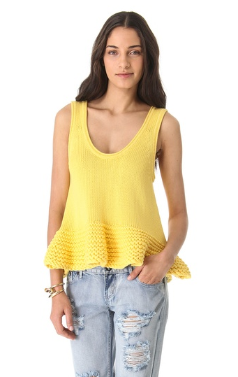 We dig this Bec & Bridge yellow knitted top ($330) because it almost looks homemade! It would look great with jeans during the day and black leather pants at night.
We dig this Bec & Bridge yellow knitted top ($330) because it almost looks homemade! It would look great with jeans during the day and black leather pants at night.