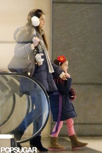 Katie Holmes wore fuzzy white earmuffs.
Katie Holmes wore fuzzy white earmuffs.