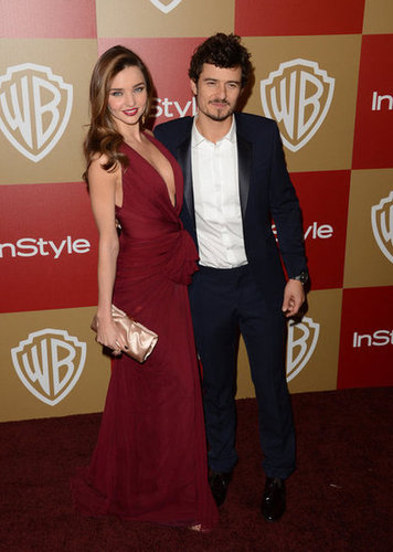 Miranda Kerr and Orlando Bloom put their arms around each other.
Miranda Kerr and Orlando Bloom put their arms around each other.