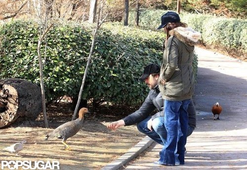 Penélope Cruz watched as Javier Bardem bent down to feed some ducks at a park in Madrid.
Penélope Cruz watched as Javier Bardem bent down to feed some ducks at a park in Madrid.