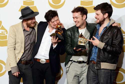Mumford & Sons celebrated their album of the year win in the press room.
Mumford & Sons celebrated their album of the year win in the press room.