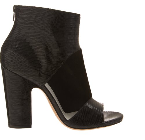 When it comes to the perfect sandal boot, look no further than these Maison Martin Margiela Cutout Sandal Booties ($920), which will go with everything.
When it comes to the perfect sandal boot, look no further than these Maison Martin Margiela Cutout Sandal Booties ($920), which will go with everything.