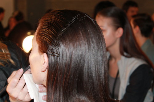 Pins were placed from ear to ear to keep the hair flat and removed before models hit the runway.
Photo: Maria Del Russo
Pins were placed from ear to ear to keep the hair flat and removed before models hit the runway.
Photo: Maria Del Russo