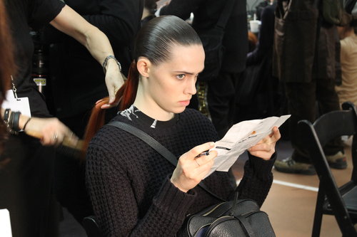 Guido slicked on Redken's Hardware Gel in sections to ensure all hair was away from models' heads. "The severity of the hair takes the personality away from the girls," he said.
Guido slicked on Redken's Hardware Gel in sections to ensure all hair was away from models' heads. "The severity of the hair takes the personality away from the girls," he said.