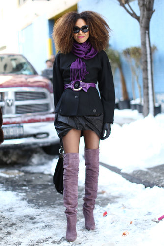 This show-goer flaunted her mile-log stems in over-the-knee boots and furthered her outfit flair with pops of purple.
This show-goer flaunted her mile-log stems in over-the-knee boots and furthered her outfit flair with pops of purple.