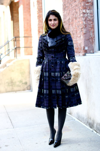 This show-goer paired a fit-and-flare dress with the coziest of mittens for an unexpectedly sweet style.
This show-goer paired a fit-and-flare dress with the coziest of mittens for an unexpectedly sweet style.