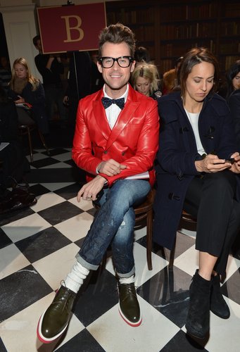 Brad Goreski took in the Tommy Hilfiger Fall '13 show in his signature mix of boyish-quirk pieces, including a bright red blazer, bow tie, and olive green lace-ups.
Brad Goreski took in the Tommy Hilfiger Fall '13 show in his signature mix of boyish-quirk pieces, including a bright red blazer, bow tie, and olive green lace-ups.