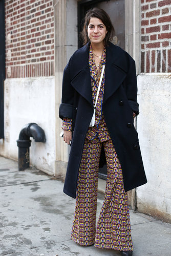 Leandra Medine looked as if she rolled right out of bed in a pair of printed PJs — and headed straight to the tents with a smart wool coat layered on top.
Leandra Medine looked as if she rolled right out of bed in a pair of printed PJs — and headed straight to the tents with a smart wool coat layered on top.