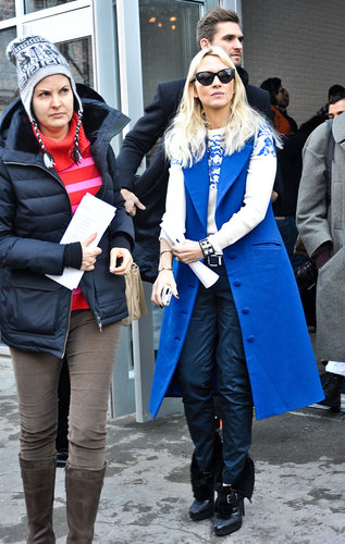 A bold blue sleeveless coat supplied a modern spin on polished daywear.
A bold blue sleeveless coat supplied a modern spin on polished daywear.